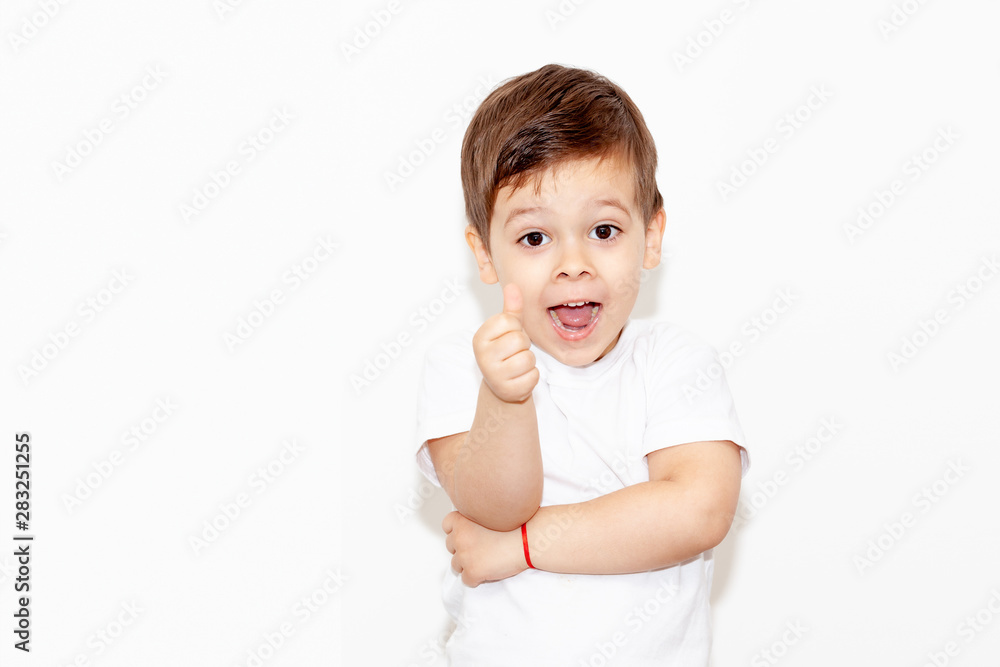 Wall mural emotional boy on a light background