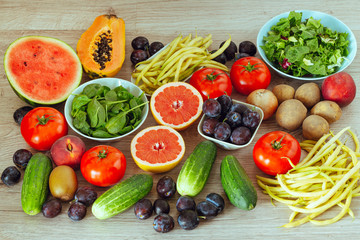 healthy diet, kitchen table full of fruits and vegetables