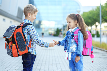 Children play a game. Little boy and girl. The concept is back to school, study, friendship.