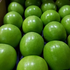 green apples on black background
