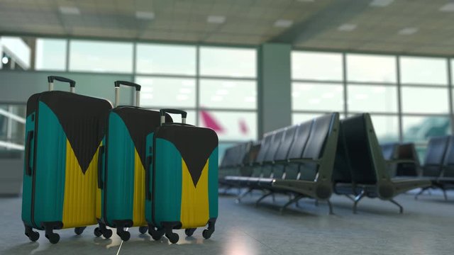 Travel suitcases with flag of Bahamas. Bahamian tourism conceptual 3D animation