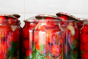 Pickling tomatoes in glass jars