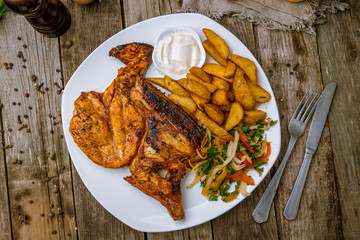 fried chicken tobacco with potatoes. Turkish cuisine