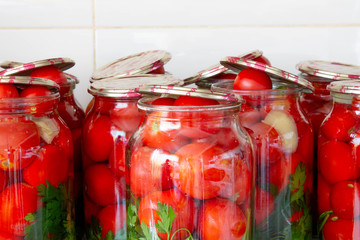 Pickling tomatoes in glass jars