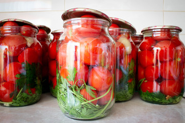 Pickling tomatoes in glass jars