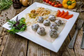 meatballs in cream sauce with rice. Turkish cuisine.