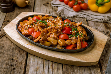 Roast chicken and vegetables on wooden table. Turkish cuisine