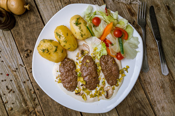 Homemade beef cutlets on wooden table. turkish cuisine