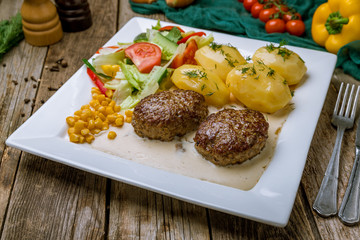 Homemade beef cutlets on wooden table. turkish cuisine