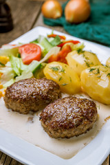Homemade beef cutlets on wooden table. turkish cuisine
