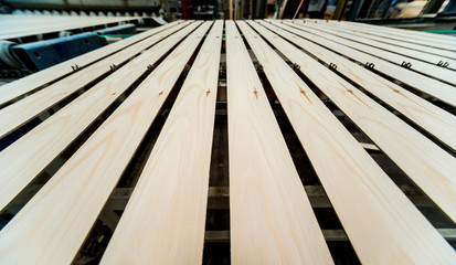 Naklejka premium Production line of the wooden floor factory. CNC automatic woodworking machine.