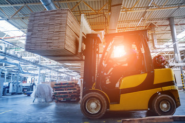 Forklift loader in storage warehouse ship yard. Distribution products. Delivery. Logistics. Transportation.