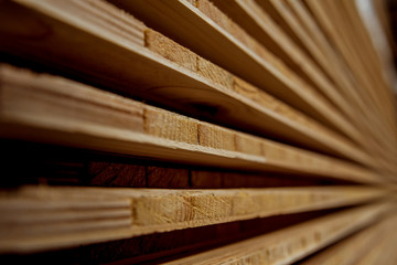Stack of natural rough wooden boards. Wooden boards, lumber, industrial wood.