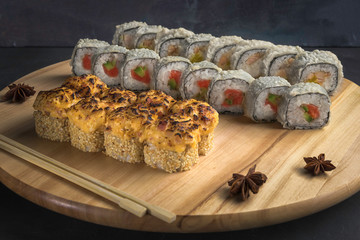 Tree japanese seafood sushi sets on wooden background and wooden chopsticks