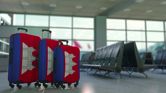 Travel suitcases with flag of Cambodia. Cambodian tourism conceptual 3D animation