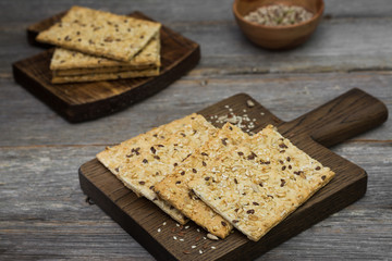 Grain loaves on a wooden Board on a wooden gray background. For healthy nutrition