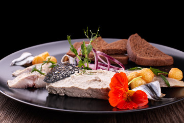 Forshmak on a black plate