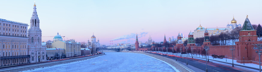 Panoramic view of the Moskva river with the Christ the Savoir's Cathedral, Kremlin's tower and a factory releasing smoke in the background in Moscow, Russia