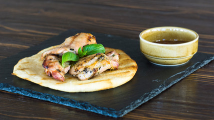 grilled chicken steak. meat on pita bread