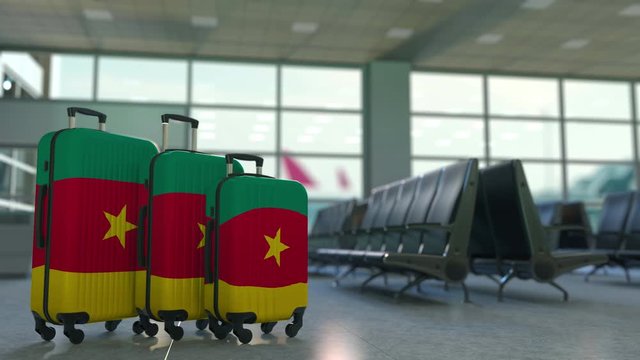 Travel suitcases with flag of Cameroon. Cameroonian tourism conceptual 3D animation