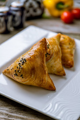 Samsa national uzbek food on old wooden table