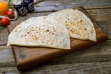 plate with Qutab on old wooden table