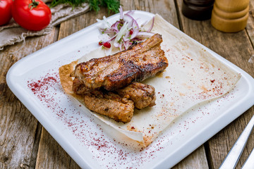 Pork ribs fried on wooden table