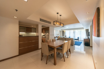 Stylish kitchen interior with dining table and chairs