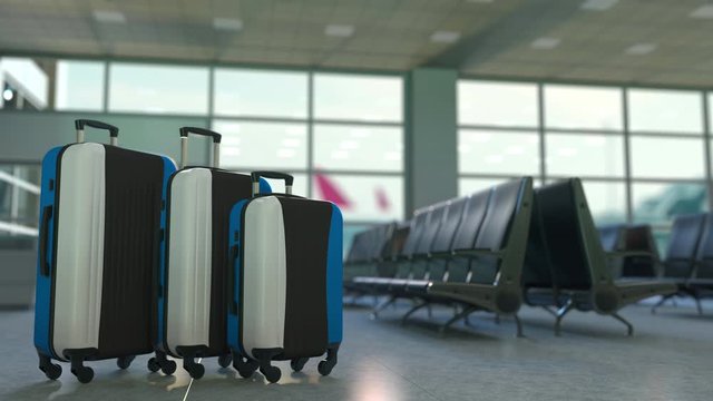 Travel suitcases with flag of Estonia. Estonian tourism conceptual 3D animation
