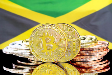 Concept for investors in cryptocurrency and Blockchain technology in the Jamaica. Bitcoins on the background of the flag Jamaica.
