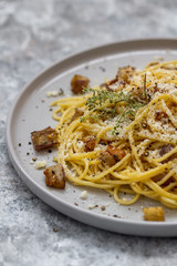 Spaghetti with eggplants, parmesan, thyme and pepper. Pasta with eggplants. Close up