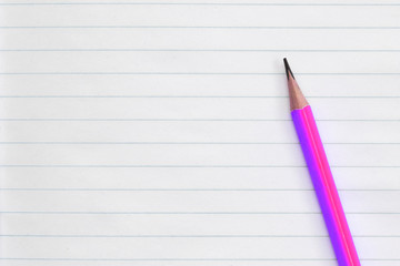 Blank notebook and pencils on white background. School supplies. White sketch book with colourful pencils. Note book and pencil