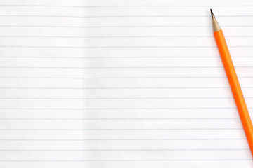 Blank notebook and pencils on white background. School supplies. White sketch book with colourful pencils. Note book and pencil