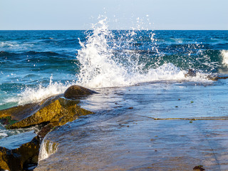 Fototapeta premium Wave crushing on the breakwater construction of a Bulgarian Black Sea Coast beach in Primorsko