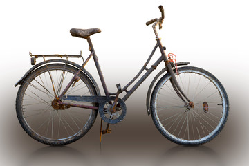 Fototapeta na wymiar Rusty bike on sparse background, with reflection in floor