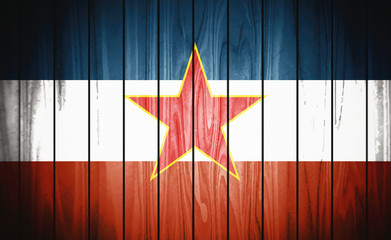 Flag of Yugoslavia, wooden background.
