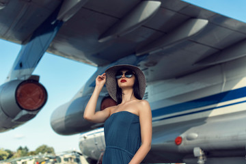 Brunette in a dress at the old airport
