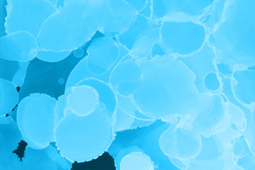 Hand painted blue alcohol ink background. Abstract delicate winter season texture. Contemporary wallpaper. 