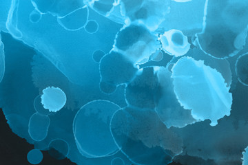 Hand painted blue alcohol ink background. Abstract delicate winter season texture. Contemporary wallpaper. 