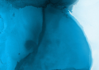 Hand painted blue alcohol ink background. Abstract delicate winter season texture. Contemporary wallpaper. 