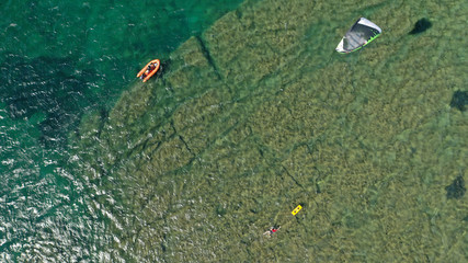 Aerial drone photo of kite surfers practising in famous bay of Loutsa or Artemida, Attica, Greece