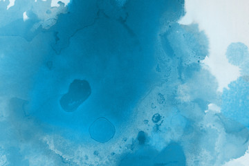 Hand painted blue alcohol ink background. Abstract delicate winter season texture. Contemporary wallpaper. 