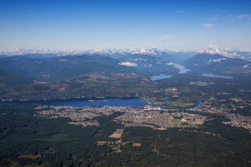 Aerial view of a small town, Port Alberni, on Vancouver Island during a sunny summer morning. Located in British Columbia, Canada.