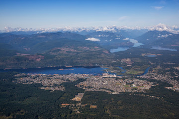 Aerial view of a small town, Port Alberni, on Vancouver Island during a sunny summer morning. Located in British Columbia, Canada.