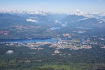 Aerial view of a small town, Port Alberni, on Vancouver Island during a sunny summer morning. Located in British Columbia, Canada.