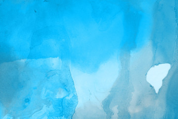 Hand painted blue alcohol ink background. Abstract delicate winter season texture. Contemporary wallpaper. 
