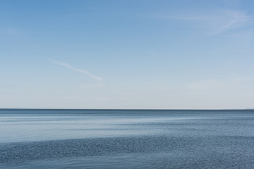 Obraz premium blue sea with calm water against sky in summertime
