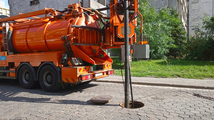 A specialized car on the street. Cleaning sewer manholes.