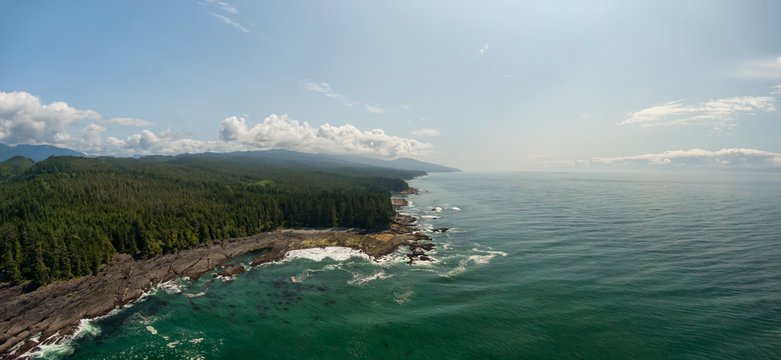 Beautiful Aerial Panoramic Landscape View of the Rocky Pacific Ocean Coast in the Southern Vancouver Island during a sunny summer day. Taken between Victorial and Port Renfrew, BC, Canada.