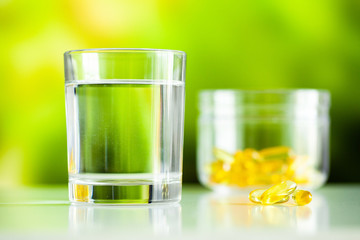 Vitamins supplements, fish oil in yellow capsules omega 3.